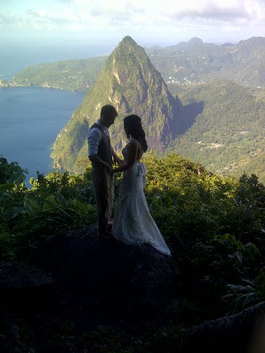 couple overlooking rocky cliff and ocean