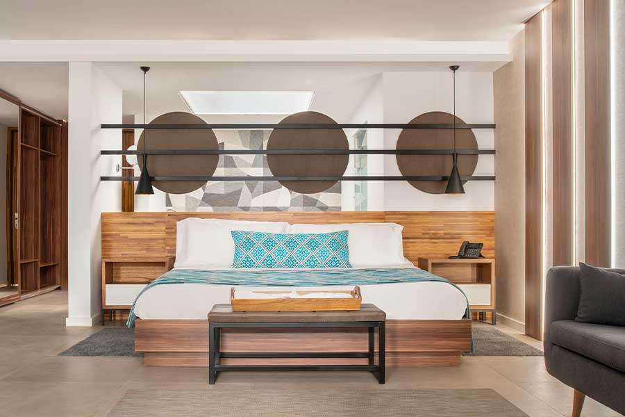 Modern hotel room with stylish wooden decor.