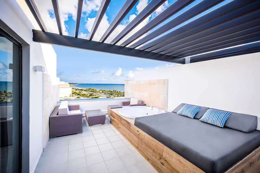 Stylish rooftop terrace with ocean view and seating