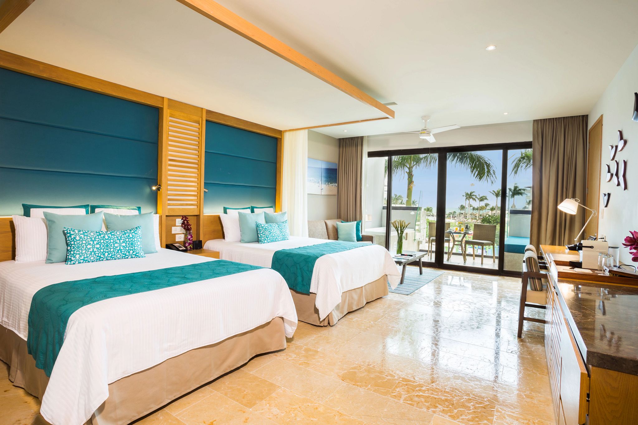 Spacious hotel room with tropical view balcony