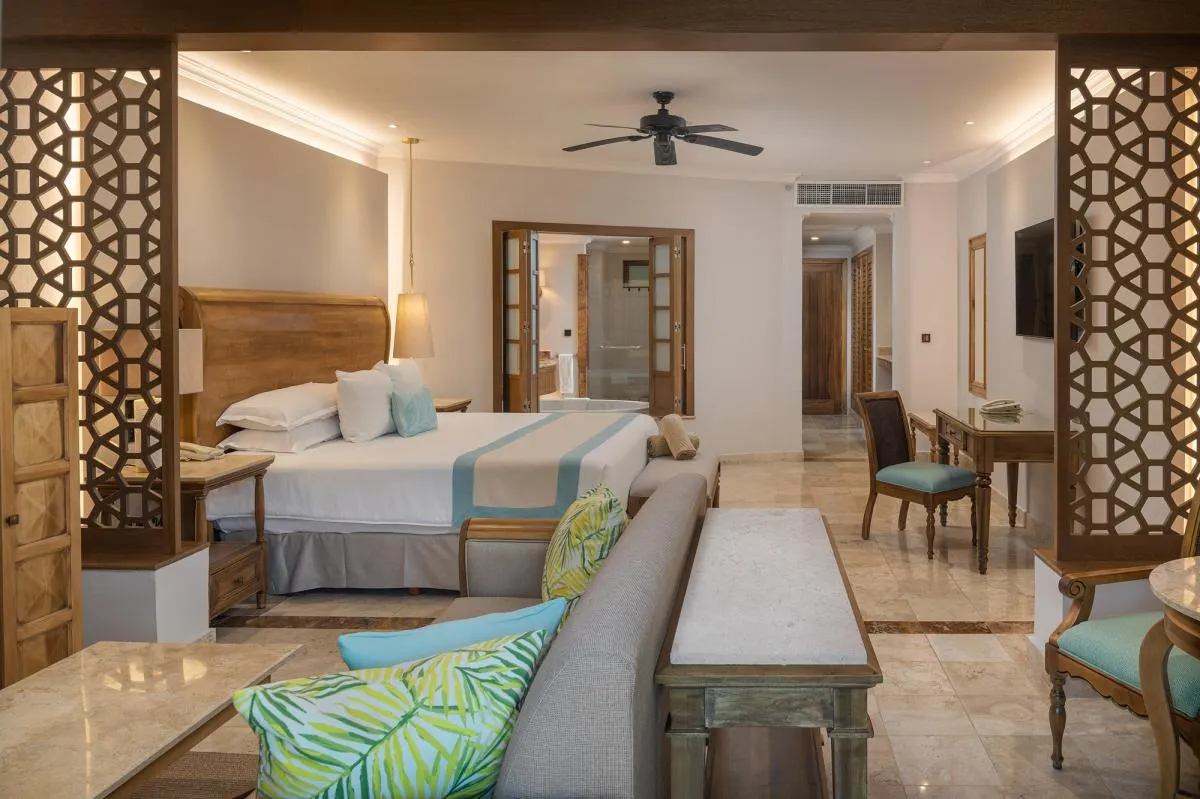Luxurious hotel suite with elegant wooden decor.