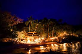 Tropical beach resort illuminated at night