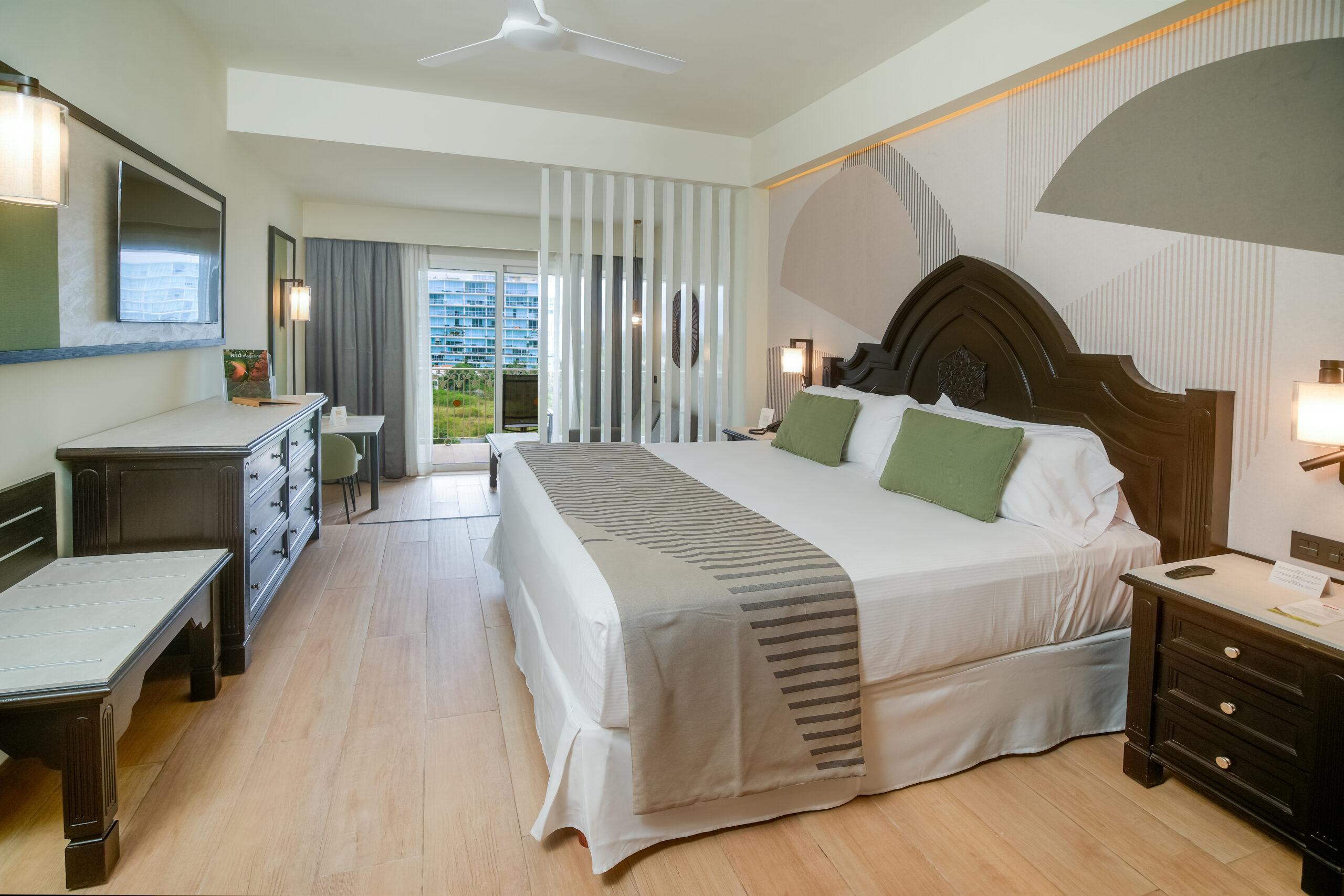 Modern hotel room with king-size bed and balcony