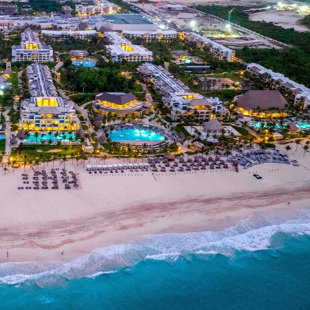 Aerial view of beachfront resort at sunset.