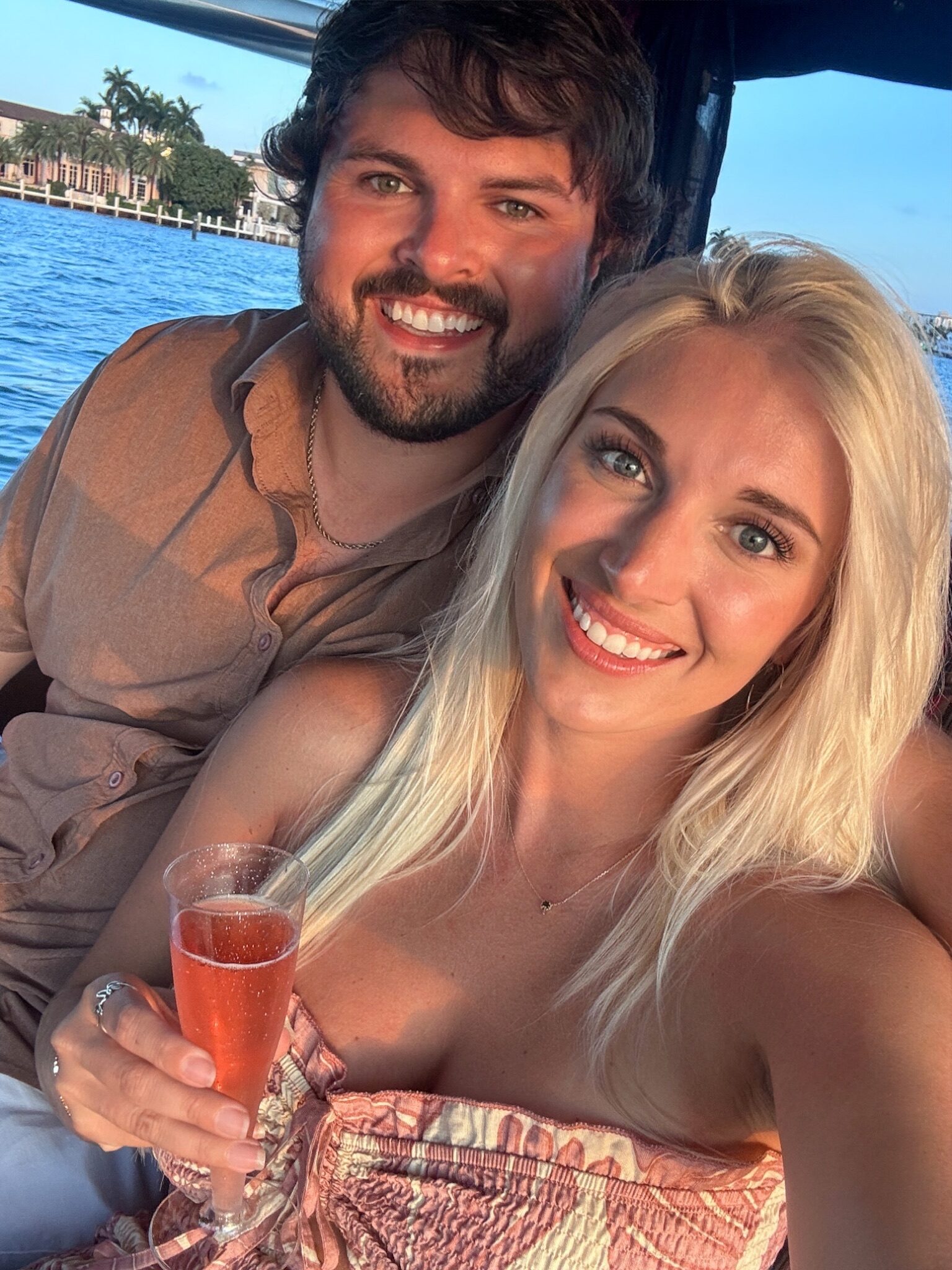 Couple selfie on the boat at sunset