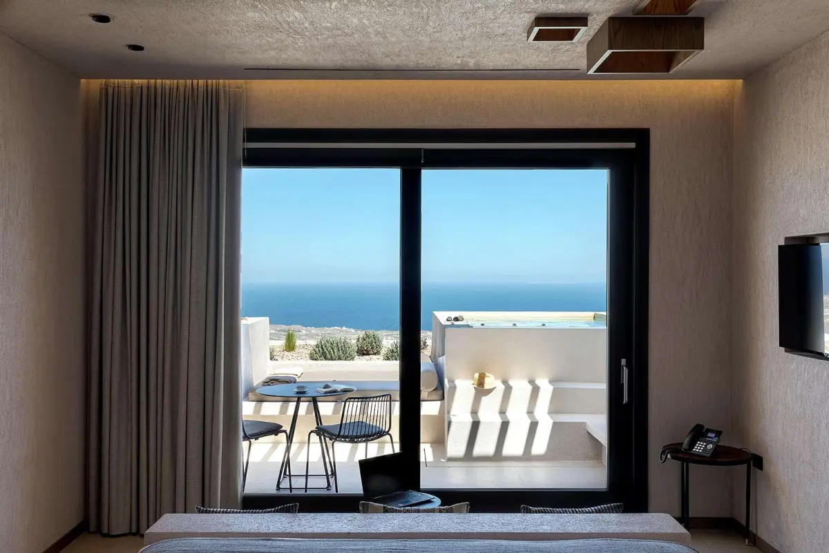 Elegant Suite bedroom looking out to the private terrace and sea