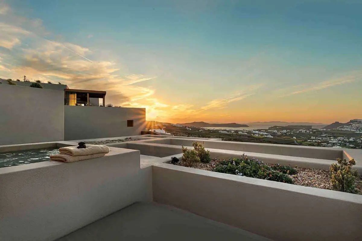 Suite terrace and hot tub at sunset above the island
