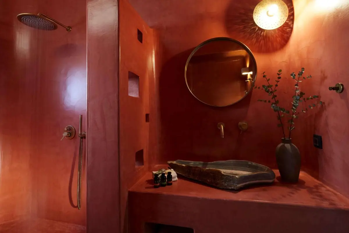 Villa bathroom in terracotta plaster with a rain shower