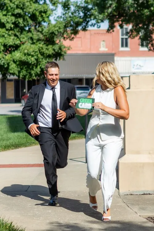 Kassidy and Nelius running down the sidewalk, laughing